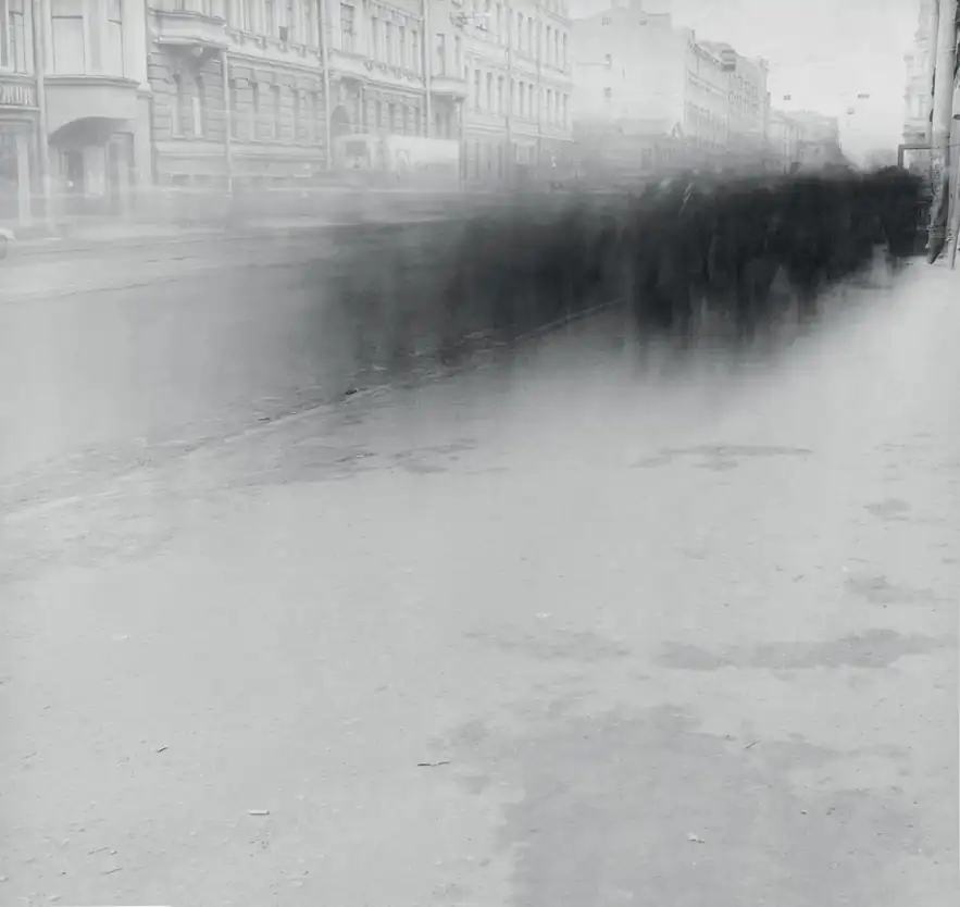 A dense crowd becomes a dark horizontal blur across snowy Sredniy Prospect in Saint Petersburg.