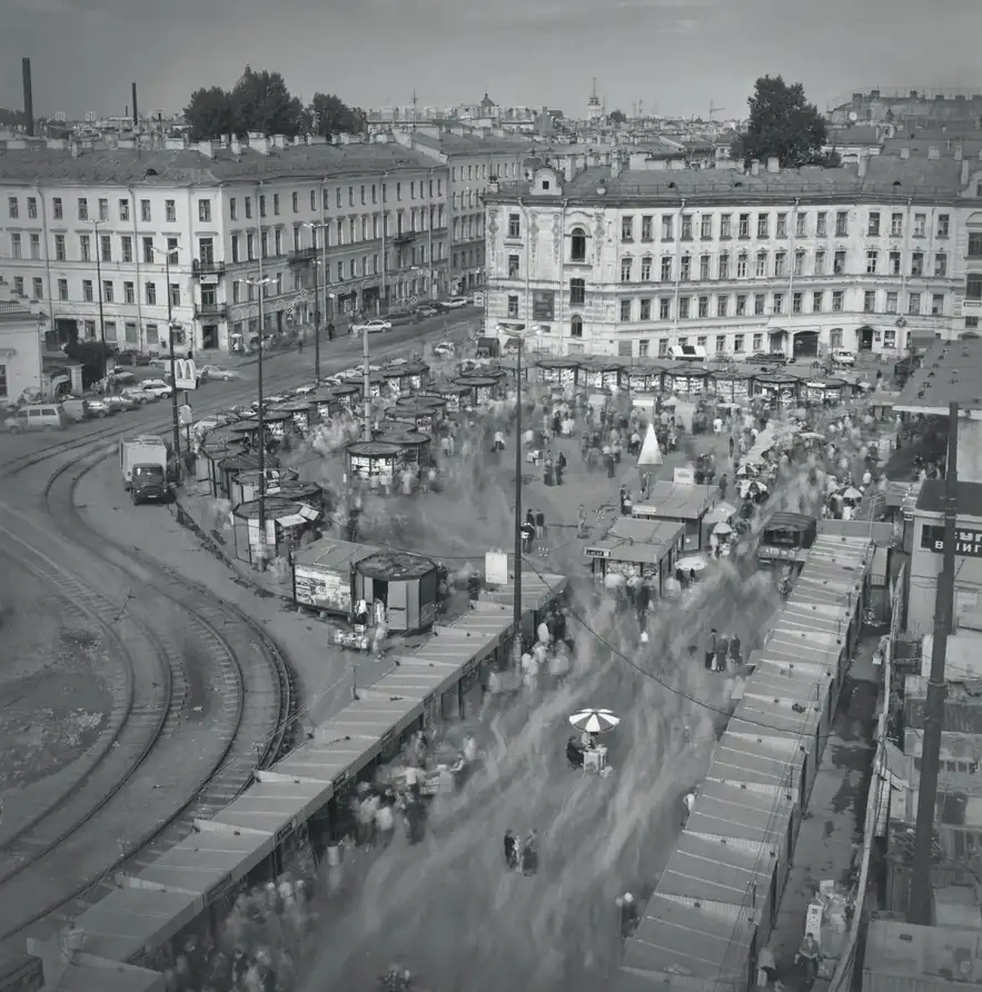 Crowds and market stalls seen from a rooftop above Haymarket Square in Saint Petersburg.