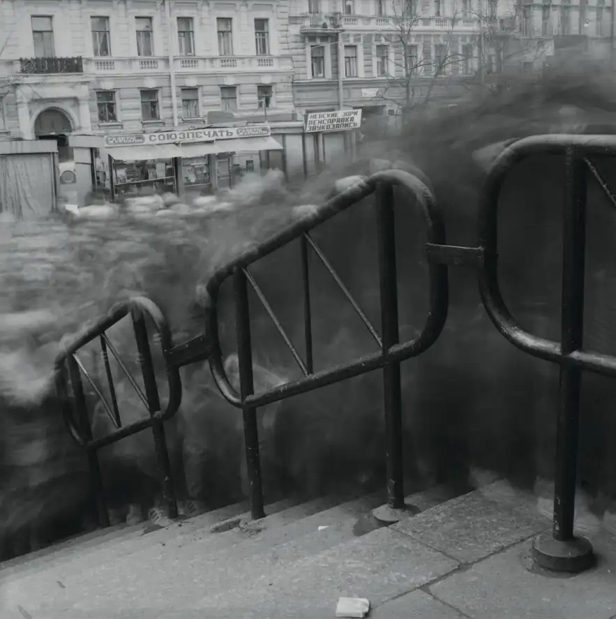 Long-exposure commuters stream down the steps outside Vasileostrovskaya Metro Station in Saint Petersburg.