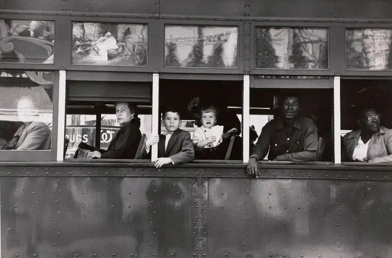 Passengers look out through the windows of a segregated New Orleans streetcar.