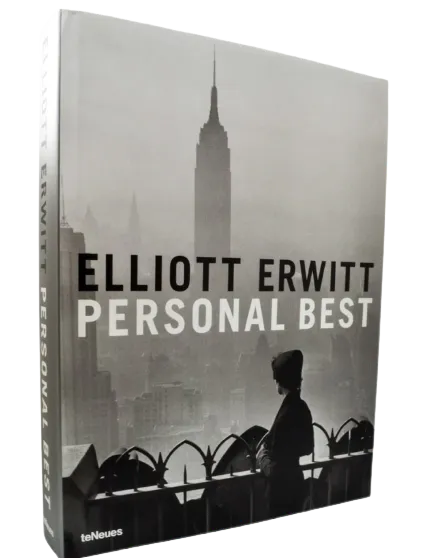 Book cover titled 'Personal Best' by Elliott Erwitt, featuring a black and white photo of a woman on a city balcony with the Empire State Building in the background.