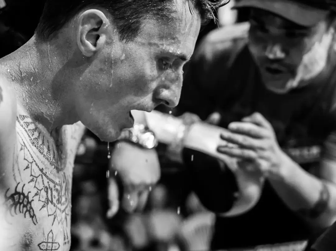 Boxer sweating between rounds at a Muay Thai fight