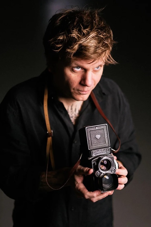 Photographer Frederik Trovatten with a Rolleiflex camera